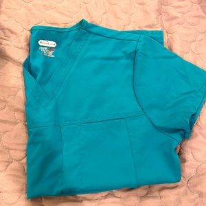 Scrub set: Caribbean blue. Size regular small. Top has 4 pockets, pants 4